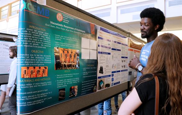 Above, Reid Chunn, a student participating in the WUSEF program, presents his research at the STEM Poster Palooza. Below, Matt Gleeson at the STEM Poster Palooza.